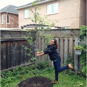 LEAF staff posing happily next to a newly planted serviceberry(© 2018 Brenna Anstett)