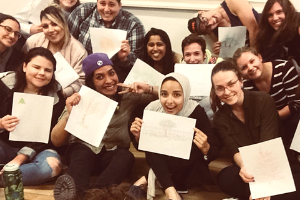 Group of young women happily posing with certificates(© 2018 Erin MacDonald)