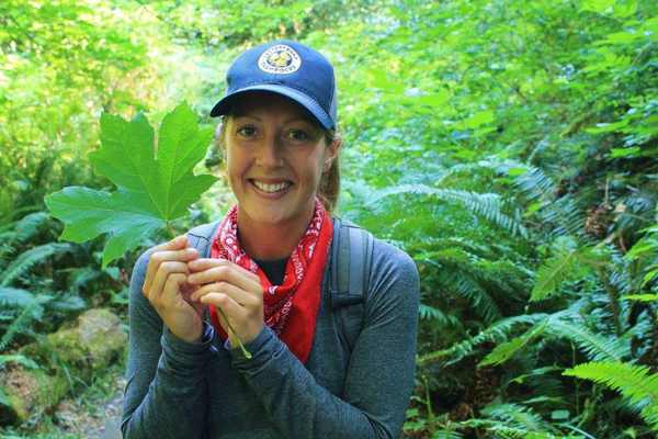 Brenna with bigleaf maple leaf (© 2023 LEAF)
