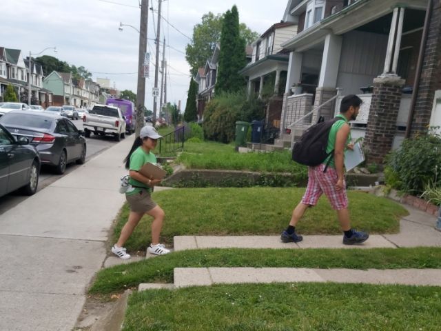 YUFLs walking up to a house.(© 2019 Lam Tran / LEAF)
