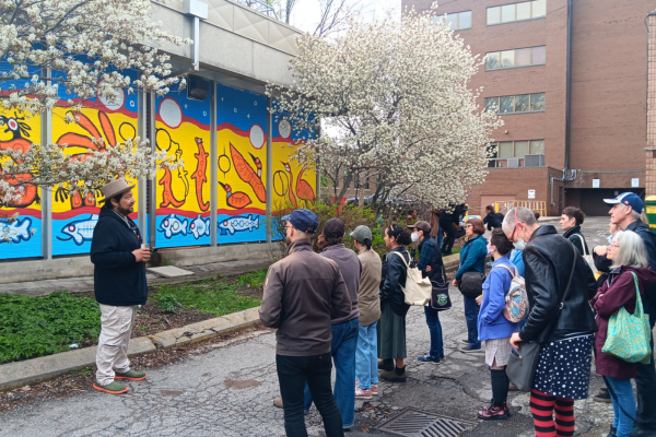 Thomas Sinclair presenting his mural at the Bathurst Station Urban Forest Demonstration Garden(© 2024 Brian Millward / LEAF)