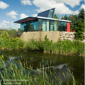 © 2008 Caitlin Carpenter Glass building overlooking a pond(© 2008 Caitlin Carpenter)