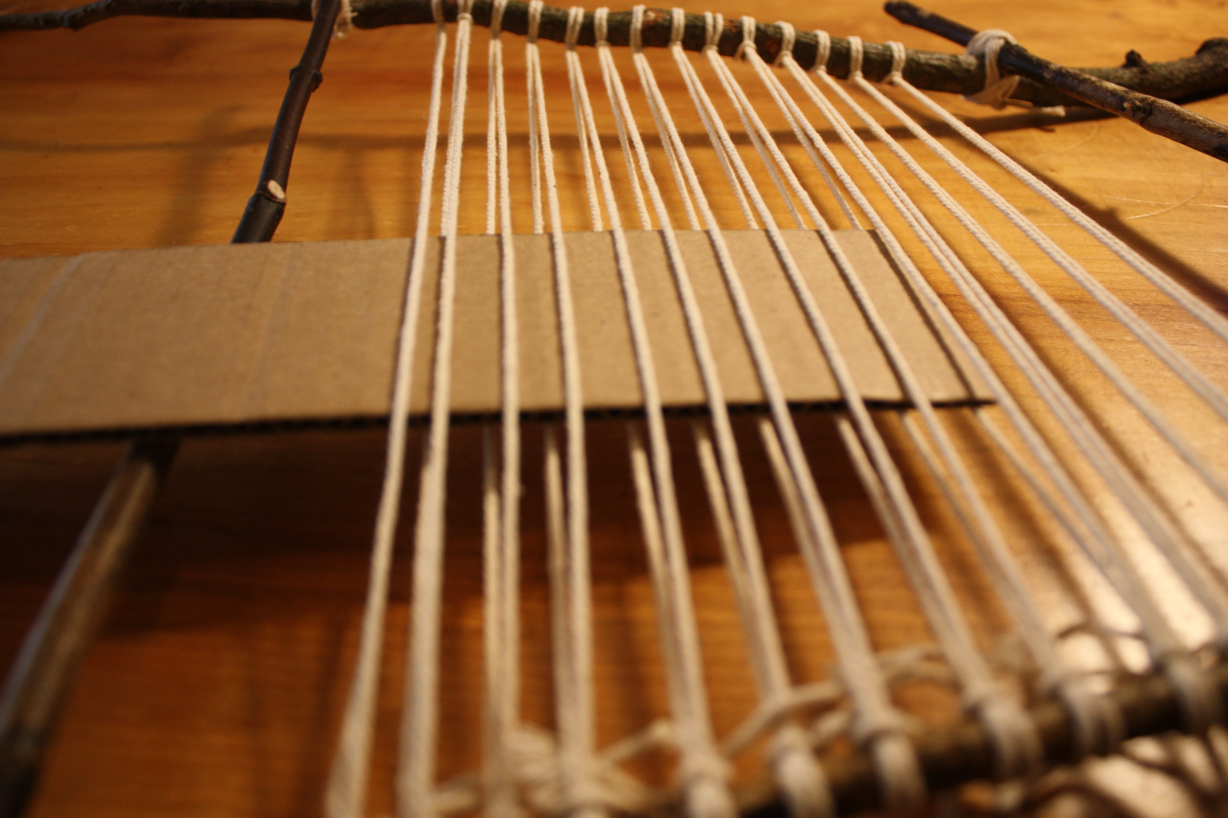 Cardstock woven through warp in plain weave pattern