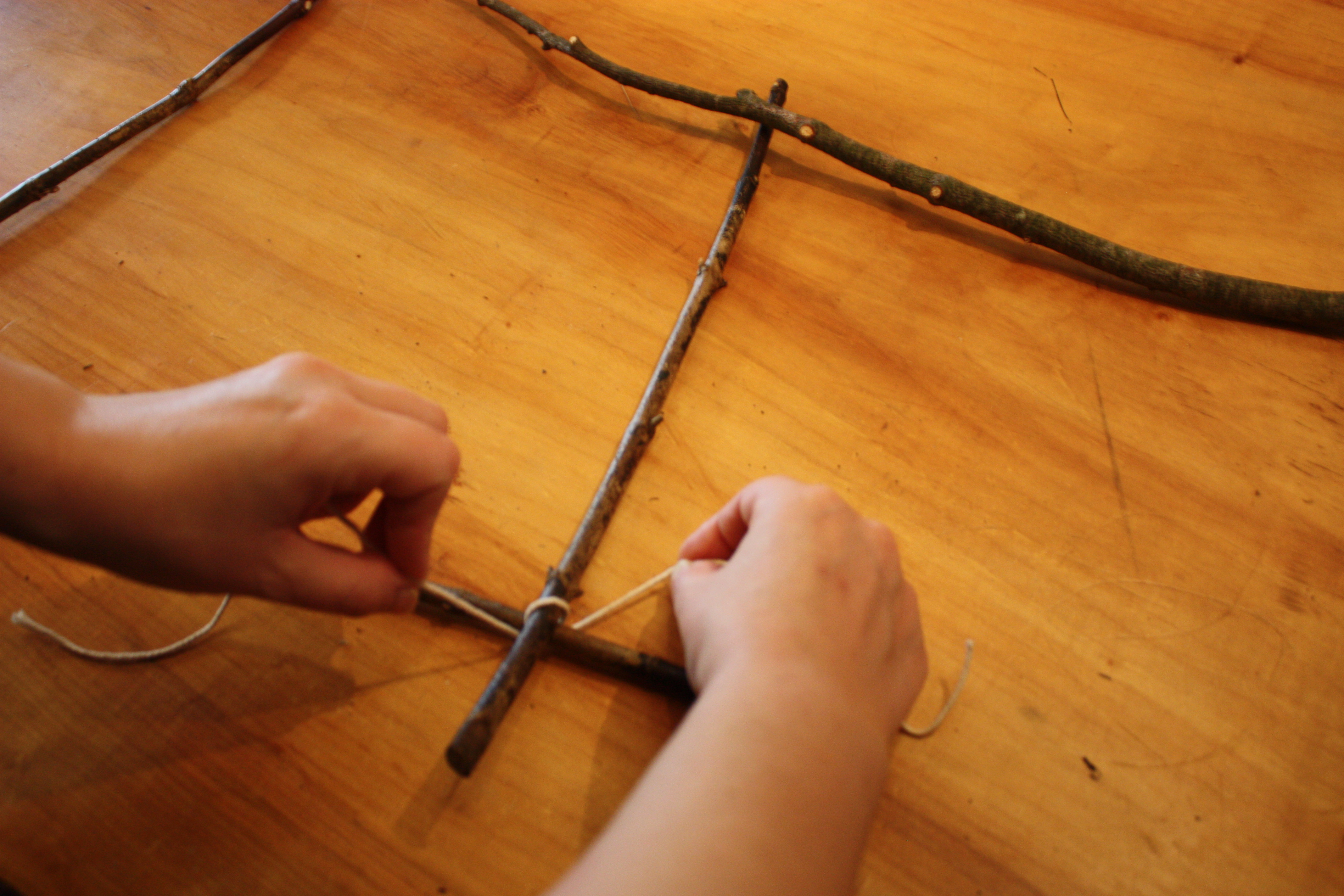 Corner secured with cross-over knotting and wrapping