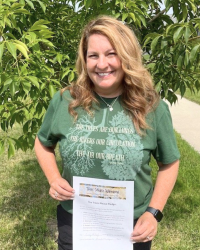 Winnipeg City Councillor, Cindy Gilroy, signs the Trees Please Pledge during electoral race of 2022