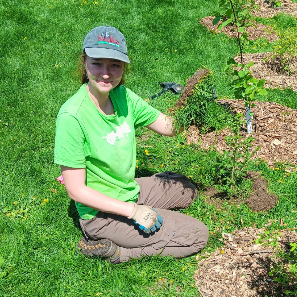 Lauren planting native trees and shrubs during our community planting event in Carrville Park in Richmond Hill.