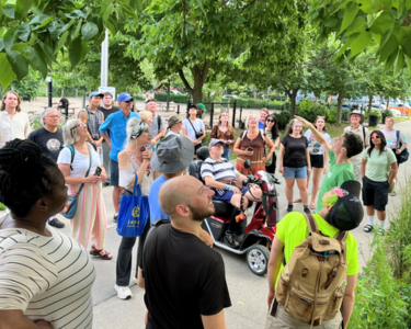 LEAF staff leading a large group on a tree tour