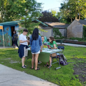 Volunteers at shrub giveaway table. (© 2019 Lam Tran LEAF)