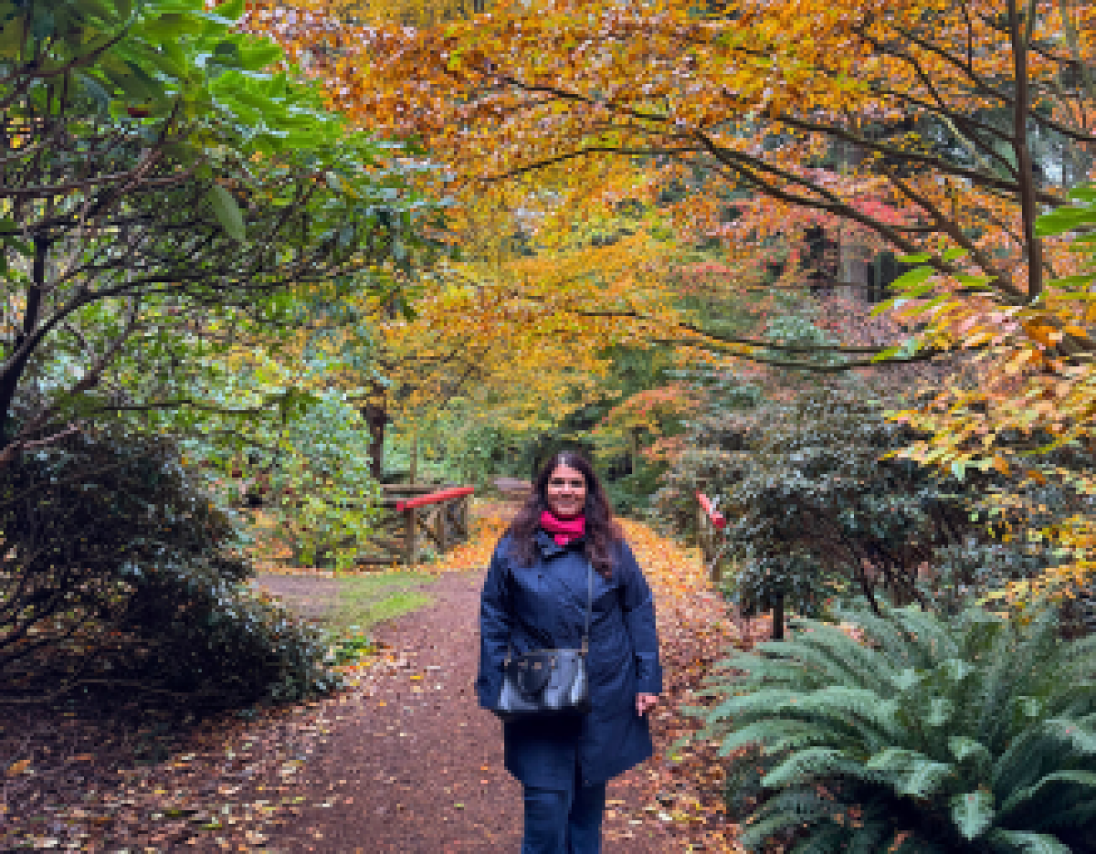 © 2026 Masarrat Quader / LEAF Masarrat surrounded by fall foliage.