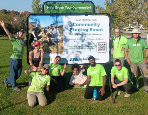 group of volunteers posing at a LEAF community planting event