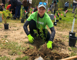 A volunteer participating at a LEAF planting event