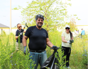 A group of three participating at a LEAF stewardship event