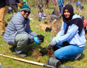 Two participants at a LEAF planting event