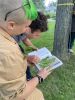 two YUFL looking at a tree ID book