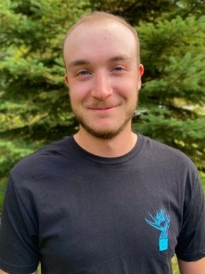 Jon standing with trees (©2021 Sidney Cummings)