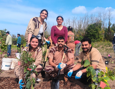 © 2024 Brian Millward / LEAF group of volunteers posing at a LEAF community planting event
