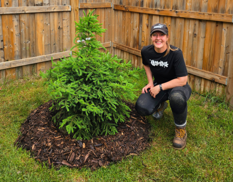 LEAF staff posing with newly planted white spruce