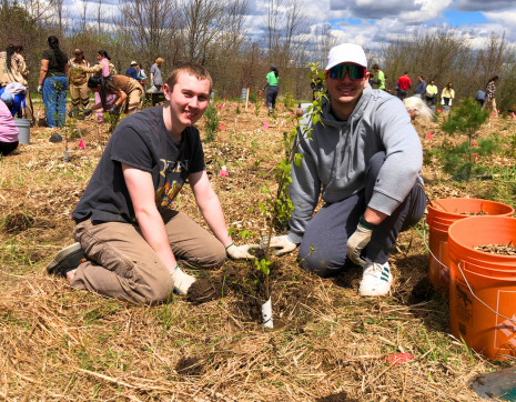 Two volunteers participating at a LEAF planting event