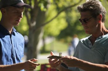 Tour participants examine EAB specimens